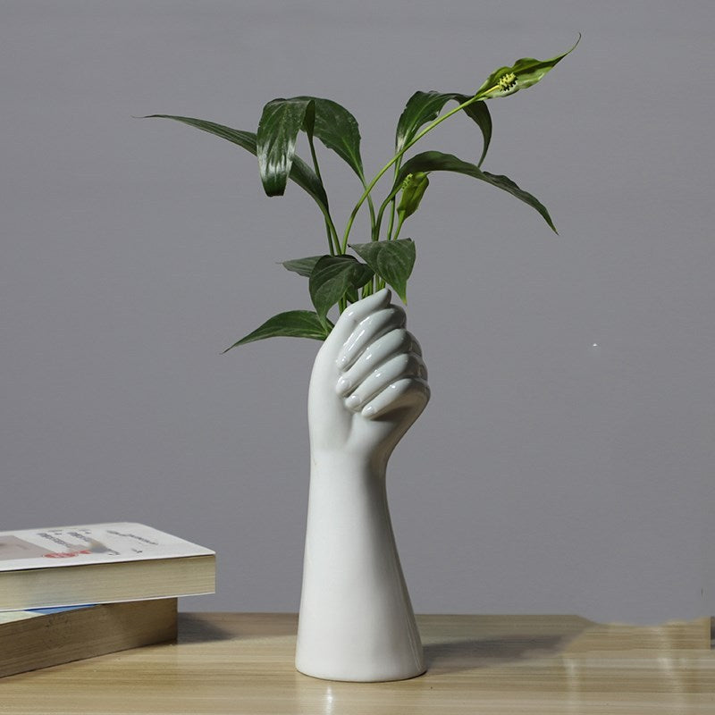 Hand flower arrangement vase